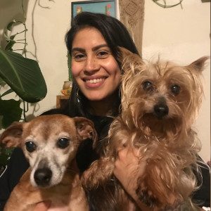Jasmine holding two small dogs
